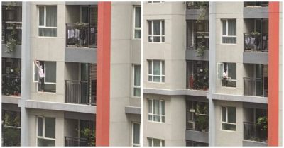 Thót tim khoảnh khắc nữ giúp việc trèo ra ngoài cửa sổ chung cư để lau kính