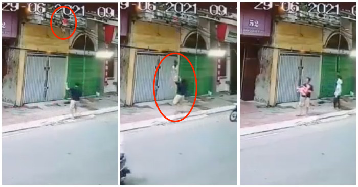 Cư dân mạng nức lòng khi xem video người đàn ông đỡ em bé rơi từ tầng 2 (ảnh chụp từ video).
