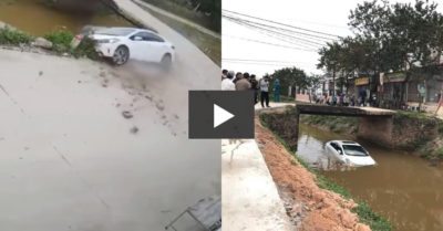 Video: Vào cua gấp, ôtô con phi thẳng xuống kênh, tài xế thoát ra ngoài bằng cửa sổ trời