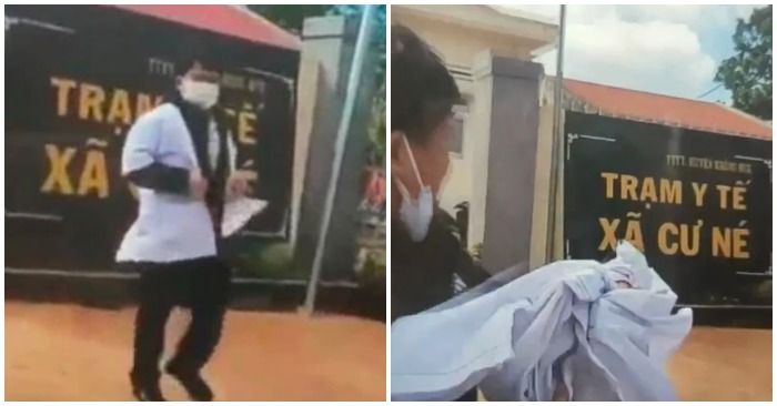Nhân viên y tế xé áo vứt trước cửa trạm y tế xã (ảnh cắt từ clip).