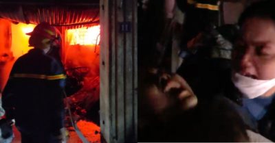 Vợ khóc ngất khi chồng và 2 con đang mắc kẹt bên trong đám cháy