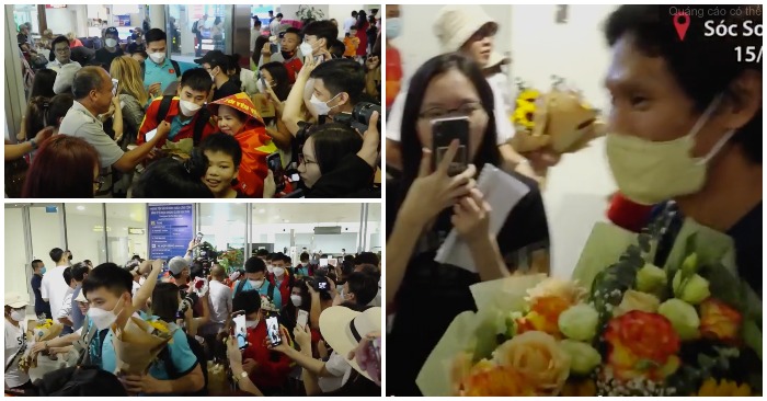 Thầy trò HLV Gong và các cầu thủ U23 Việt Nam về Nội Bài trong sự chào đón nồng nhiệt từ các cổ động viên (ảnh chụp từ video).